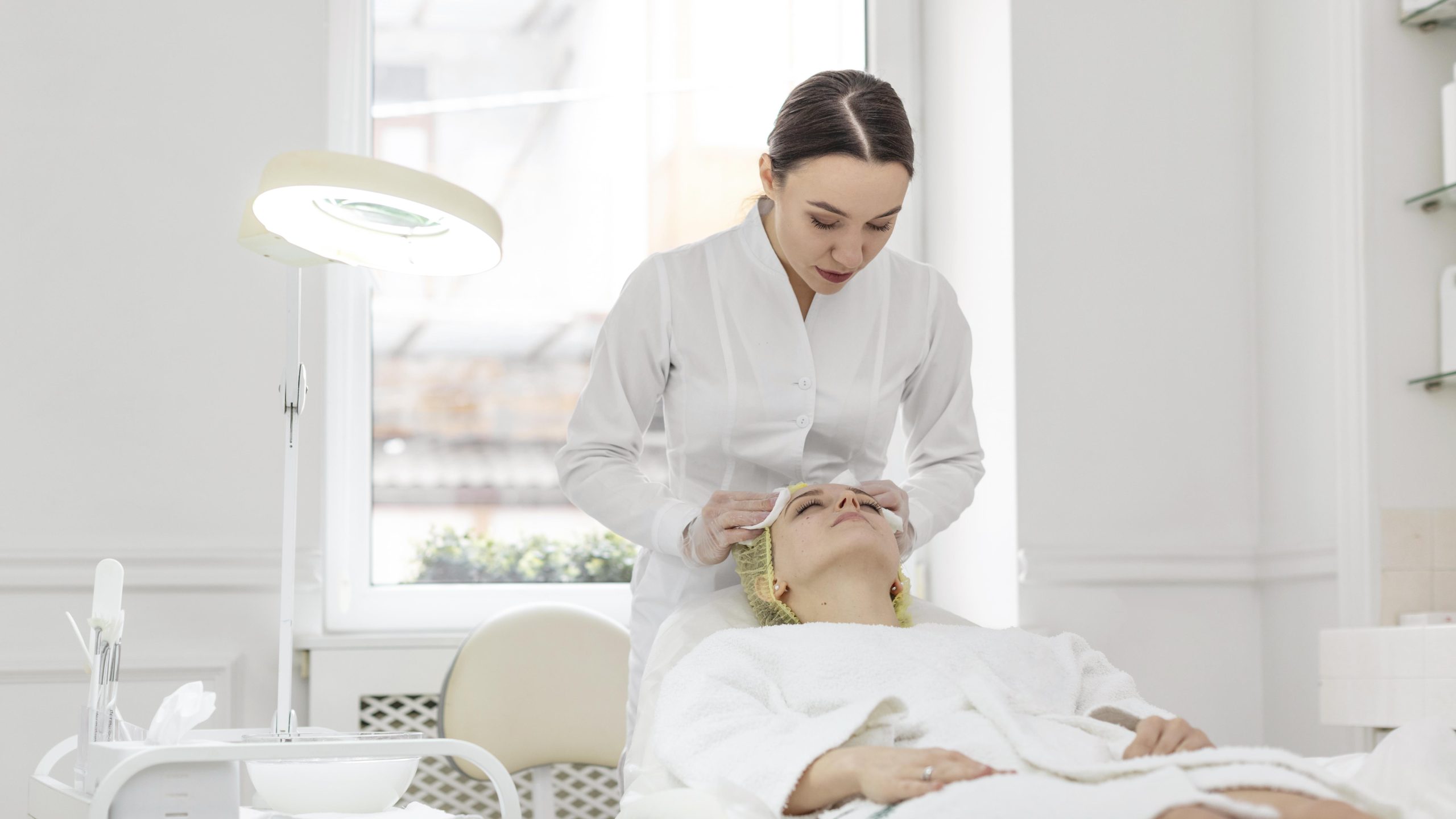 Dermatologist treating skin condition